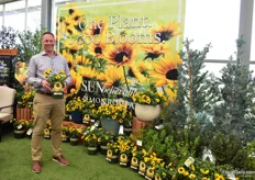Jonathan Pedersen of Monrovia presenting SunBelievable Brown Eyed Girl Helianthus, a variety bred by Thompson and Morgan and sold in North America by Monrovia. This award-winning, multi-branching, heat tolerant, non-invasive annual produces over 1,000 flowers in a single season, throughout summer until first frost. It has yellow petals with a dash of red surround the large brown center of each sensational flower.